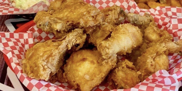 A basket of crispy fried chicken pieces, just like you'd find on The Keg menu.